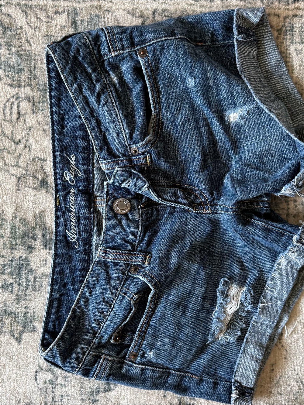 American Eagle Outfitters Blue Distressed low rise Denim Shorts with Roll Cuff